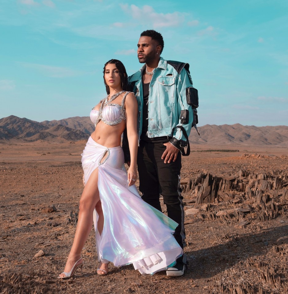 Jason Derulo and Nora Fatehi in a desert landscape.