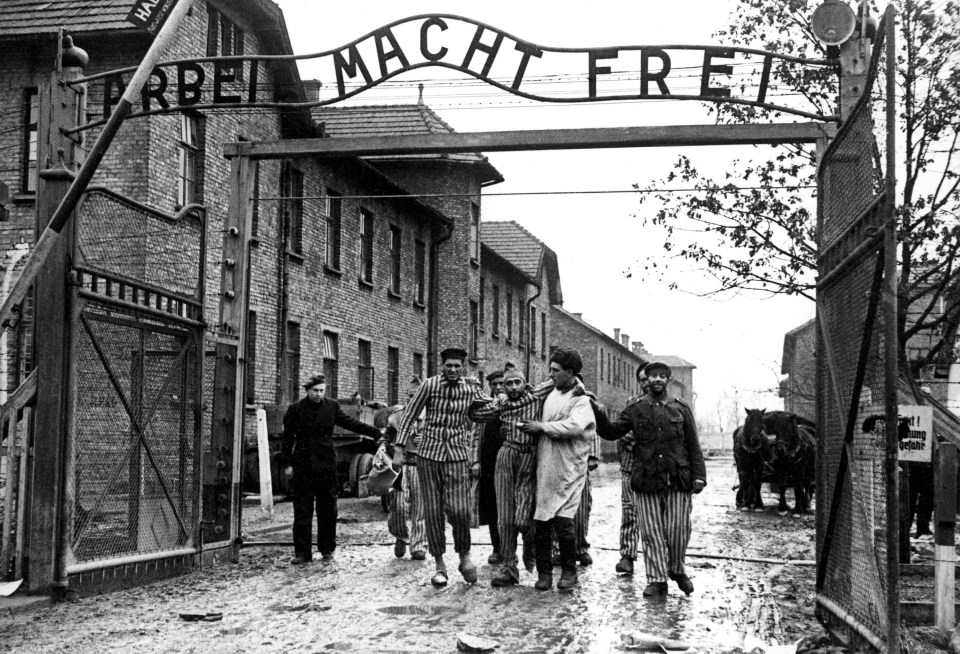 Auschwitz-Birkenau concentration camp gate;  prisoners leaving the camp in 1945.