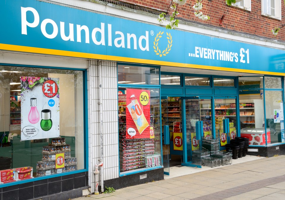 Poundland store exterior with signage and products visible in the windows.