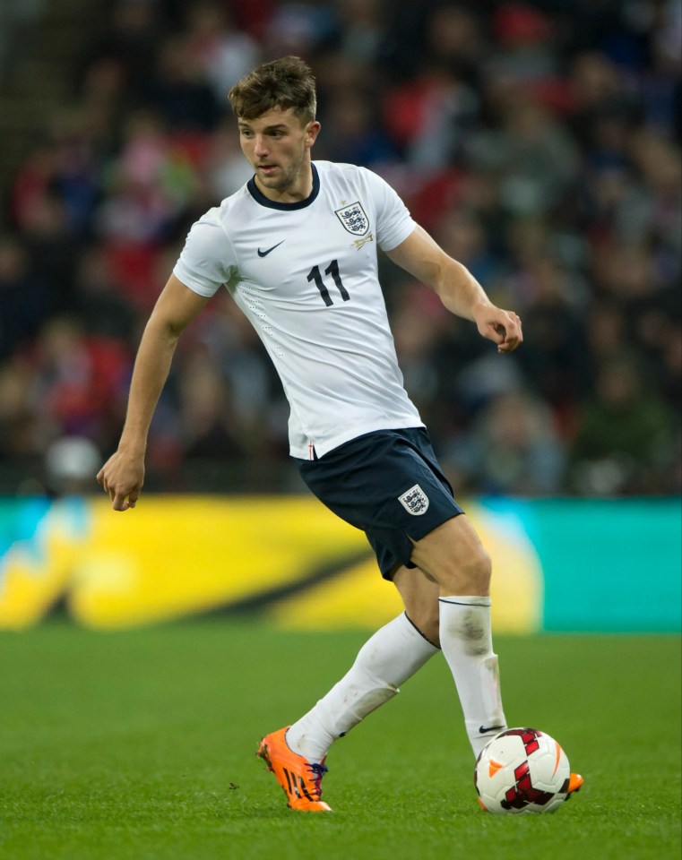 Jay Rodriguez, number 11, playing soccer for England.