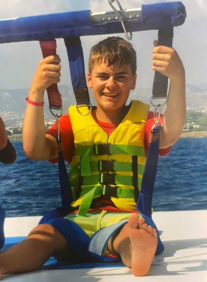 Photo of Ben Leonard, a teenager, harnessed for parasailing.