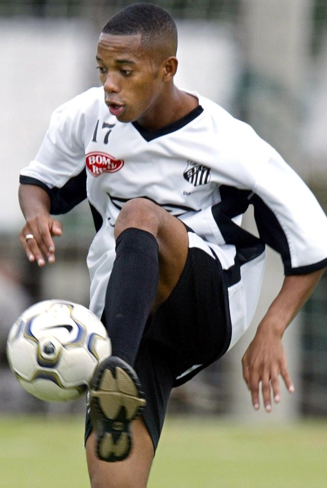 Robinho of Santos controls a soccer ball during a training session.