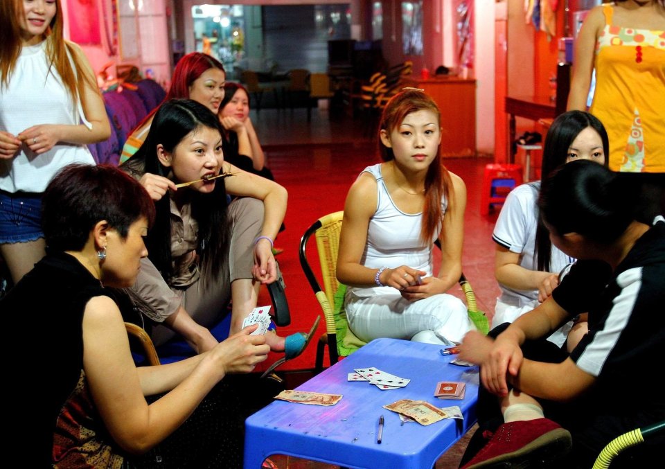 Prostitutes gambling in Mong Lar, Myanmar.