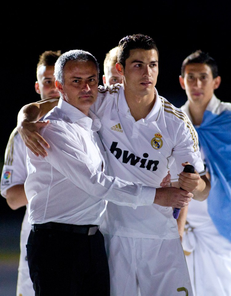 Cristiano Ronaldo and Jose Mourinho celebrating a Spanish League title win.