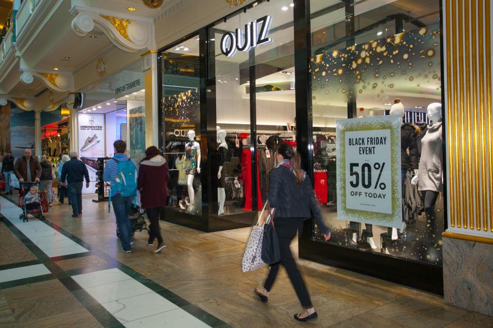 Black Friday sale at a Quiz clothing store in a shopping mall.