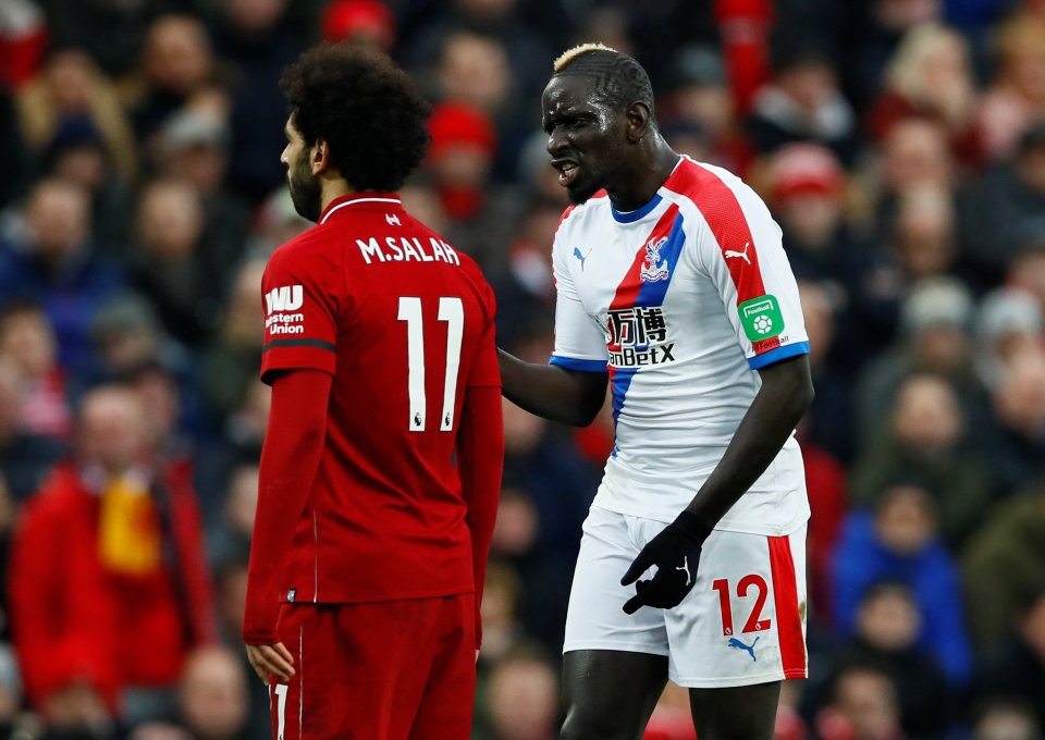 Mamadou Sakho and Mohamed Salah on a soccer field.