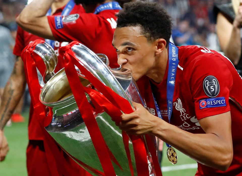 Trent Alexander-Arnold kisses the Champions League trophy.