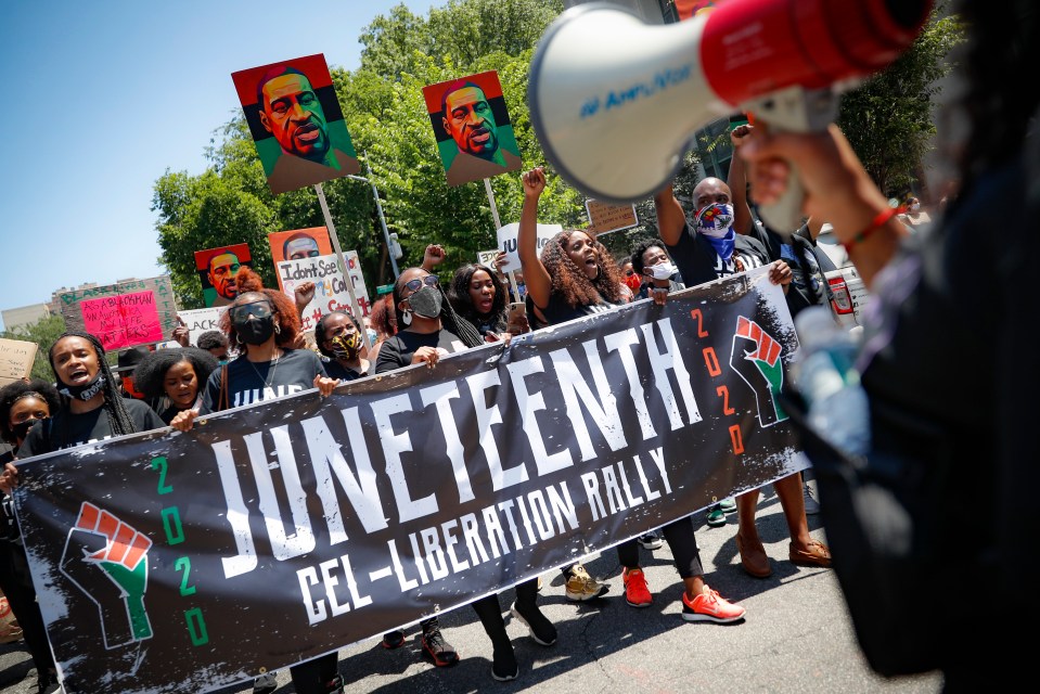 Protesters chant as they march after a Juneteenth rally at the Brooklyn Museum.