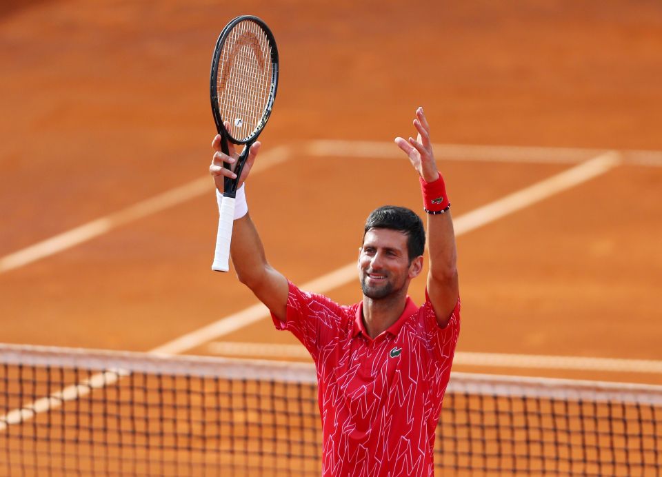 Novak Djokovic celebrates a tennis match victory.