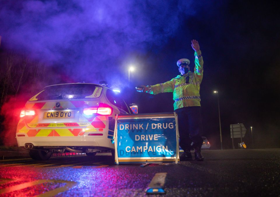 Police officer conducting a drink/drug drive campaign.