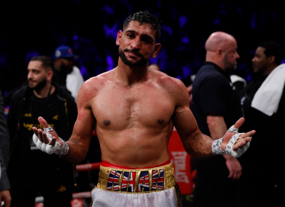 Amir Khan looking dejected after a boxing match.