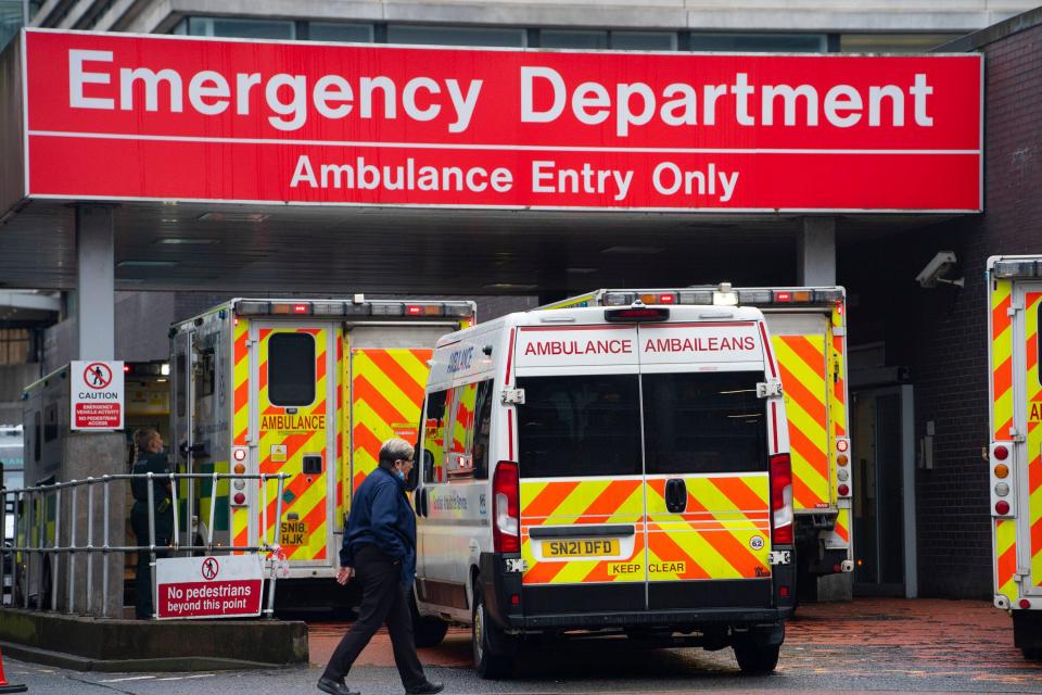 Ambulances waiting to unload patients at a hospital emergency department.