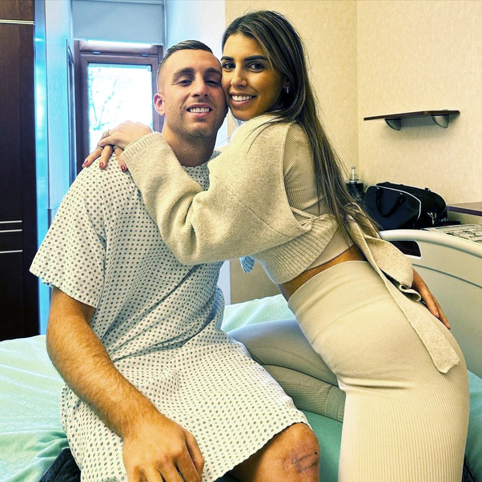 Couple embracing in a hospital room.