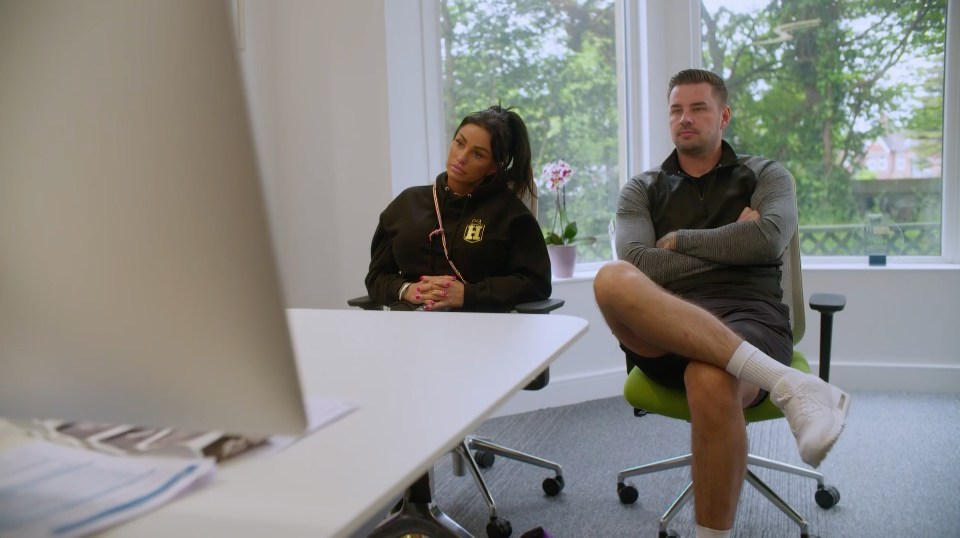 Katie Price and Carl Woods sitting in chairs during an IVF appointment.