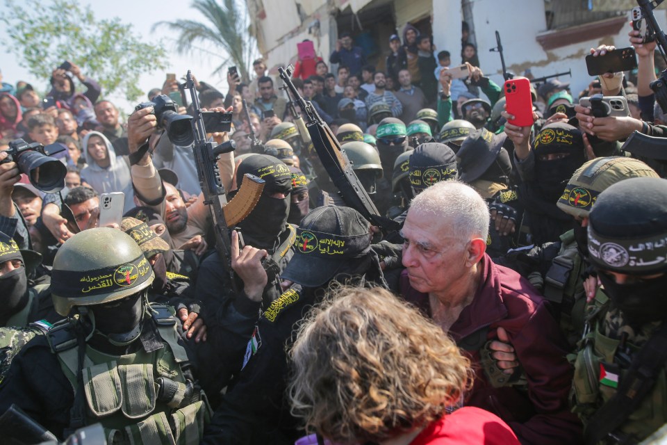 A hostage escorted by Hamas and Islamic Jihad fighters.