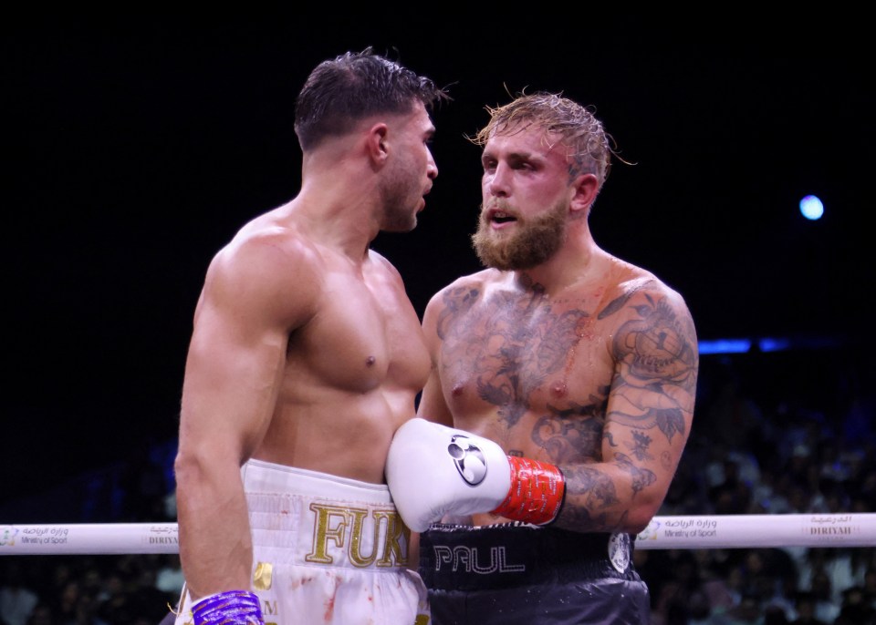 Tommy Fury and Jake Paul after a boxing match.