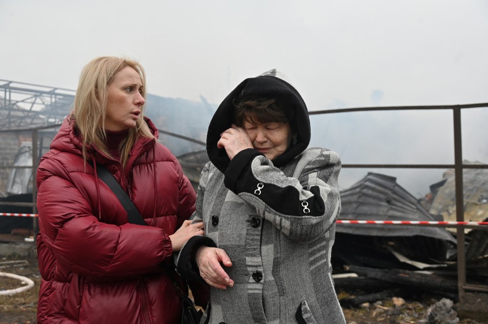 A Ukrainian resident weeps after her neighbours’ house was destroyed in a drone strike in Kharkiv