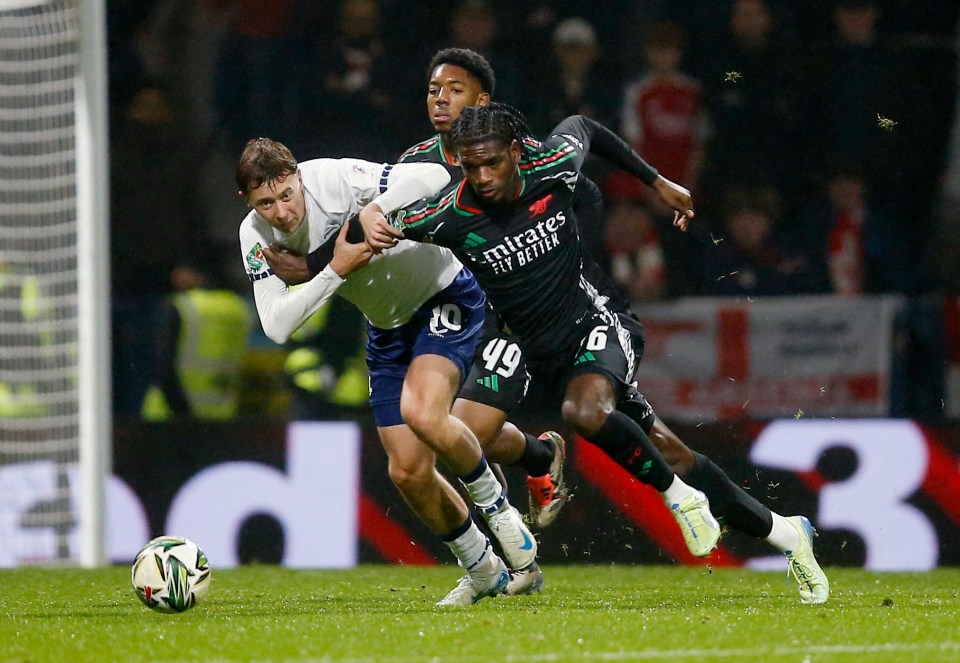 Soccer players vying for the ball.