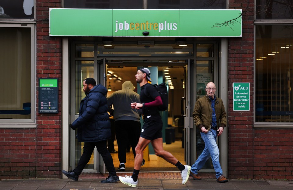 People walking past a Jobcentre Plus in London.