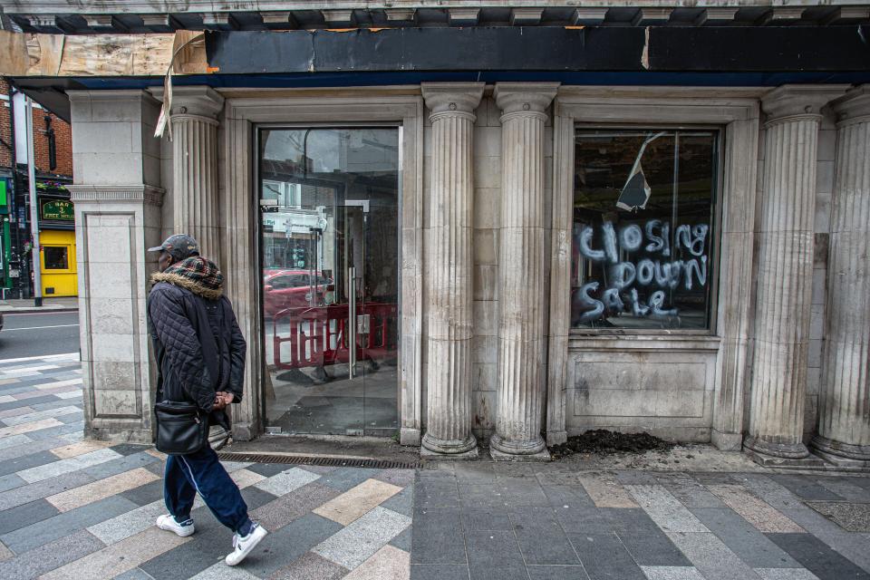 Closed down shop with a "Closing Down Sale" sign.