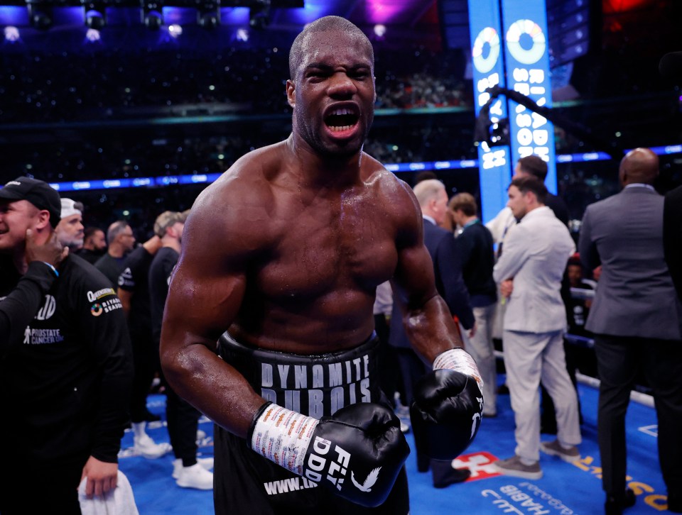 Daniel Dubois celebrates winning a boxing match.