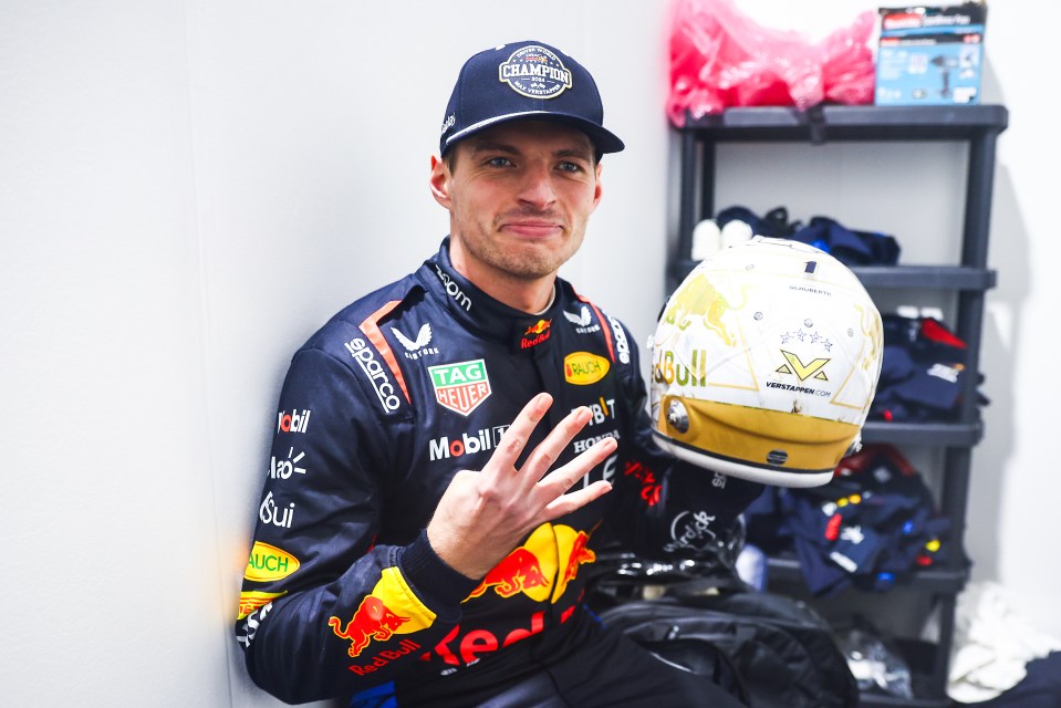 Max Verstappen, 2024 F1 World Drivers' Champion, holding his helmet.