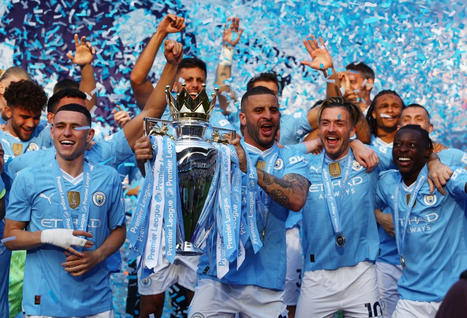 Manchester City players celebrating Premier League victory.