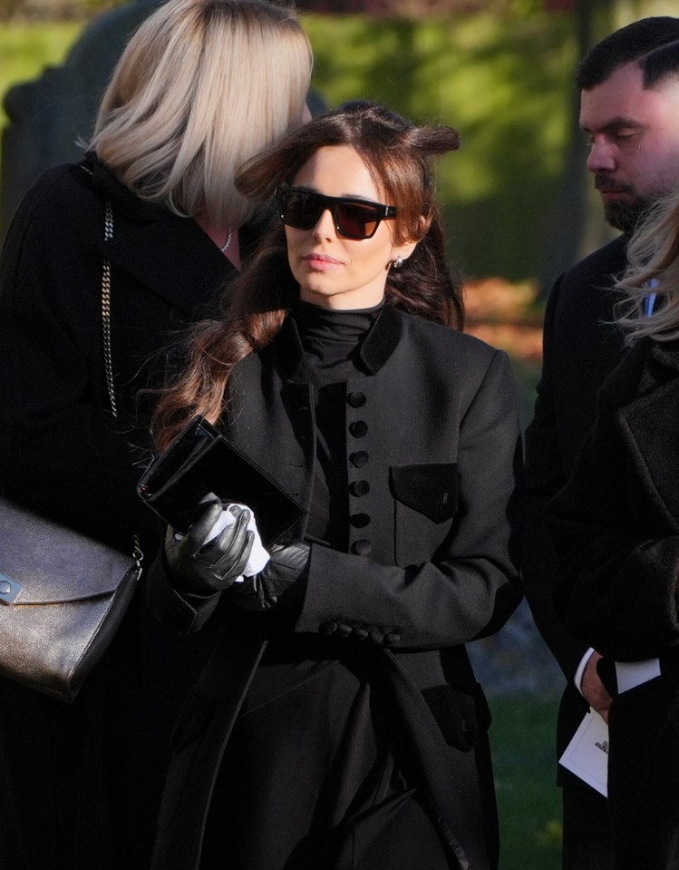 Cheryl leaving a funeral.