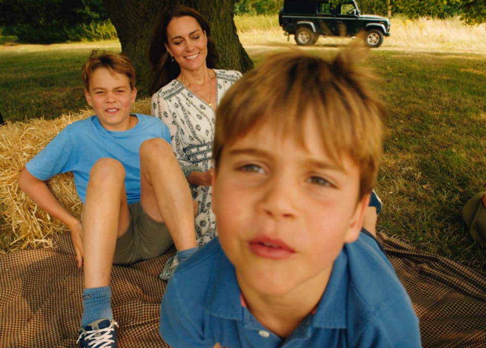 The Princess of Wales with her children on a picnic.