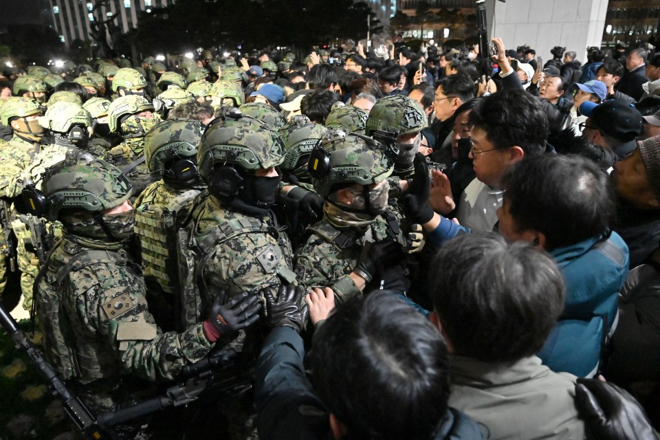 Soldiers tussled with protesters as they tried to storm the parliament