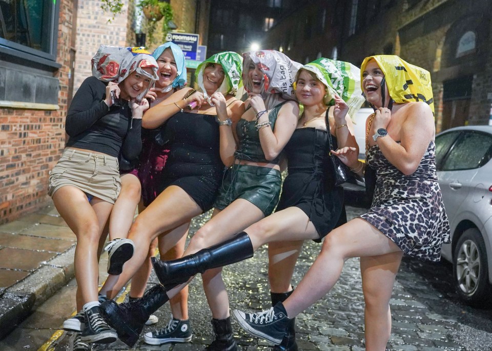 Pals hides under a row of plastic bags as they do the can-can