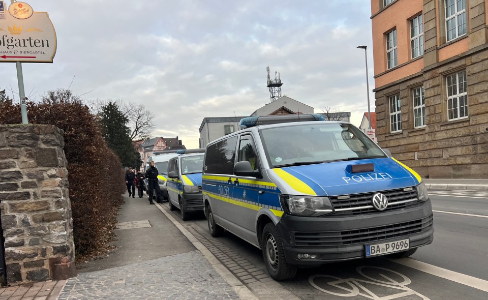 Police vans at a crime scene.