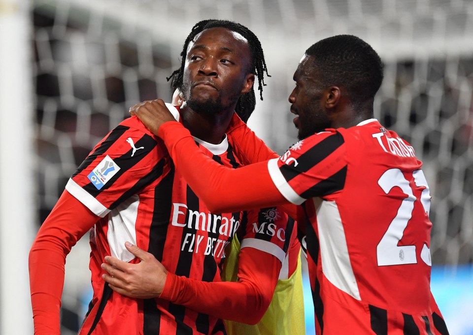 Tammy Abraham of AC Milan celebrates a goal with a teammate.