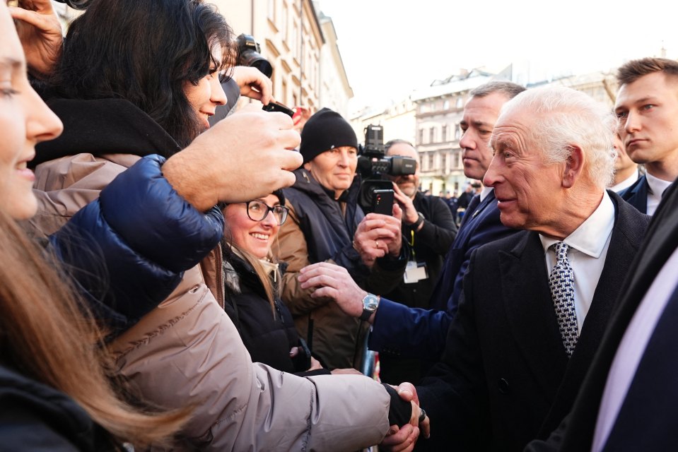 King Charles III shaking hands with well-wishers in Krakow, Poland.