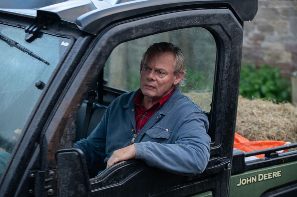 Martin Clunes as a farmer in a John Deere vehicle, from the ITV thriller "Out There."