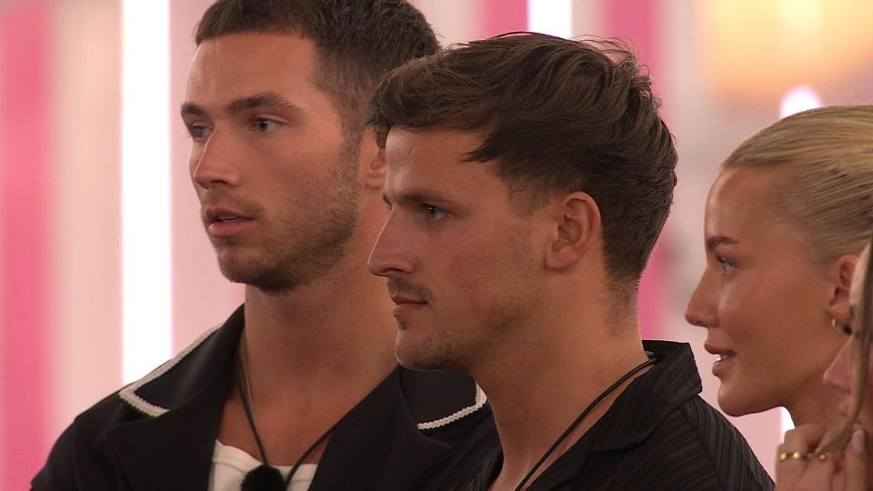 Screenshot from Love Island: All Stars showing Harriet apologizing to Elma as Ron comes clean.