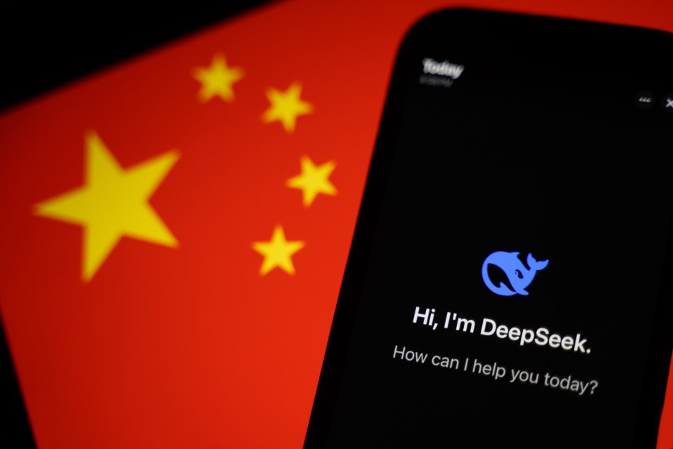 Illustration of a smartphone displaying the DeepSeek app against a blurred Chinese flag.