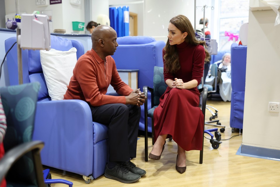 Catherine, Princess of Wales, speaks with a man at The Royal Marsden Hospital.