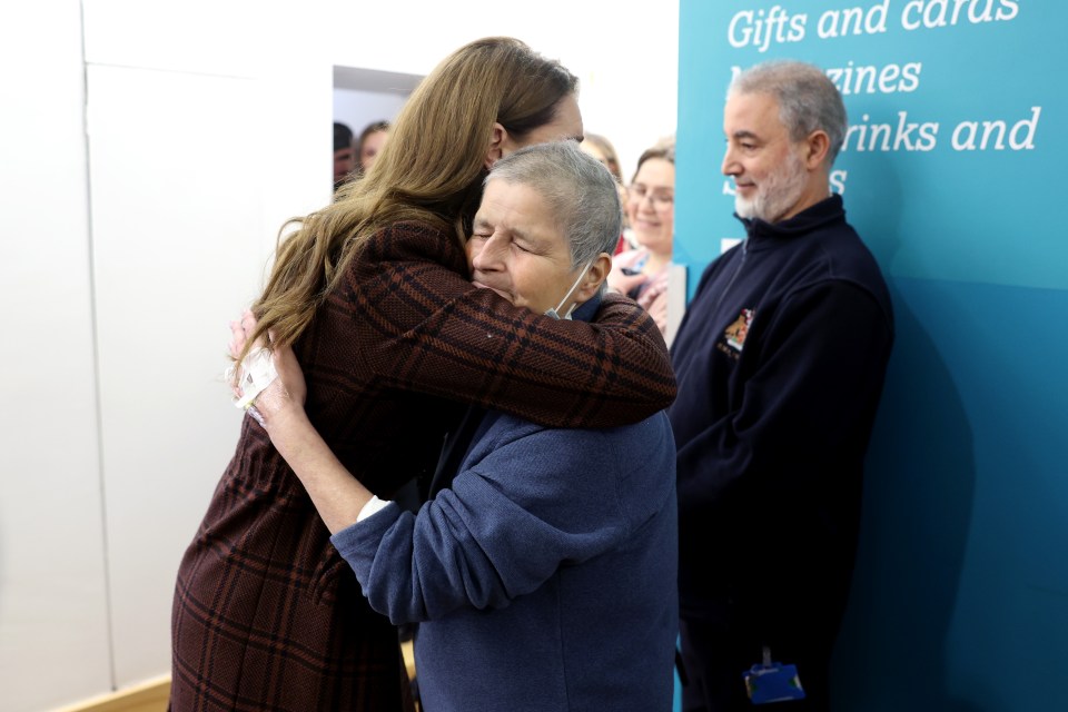 Princess Catherine hugging a patient at a hospital.