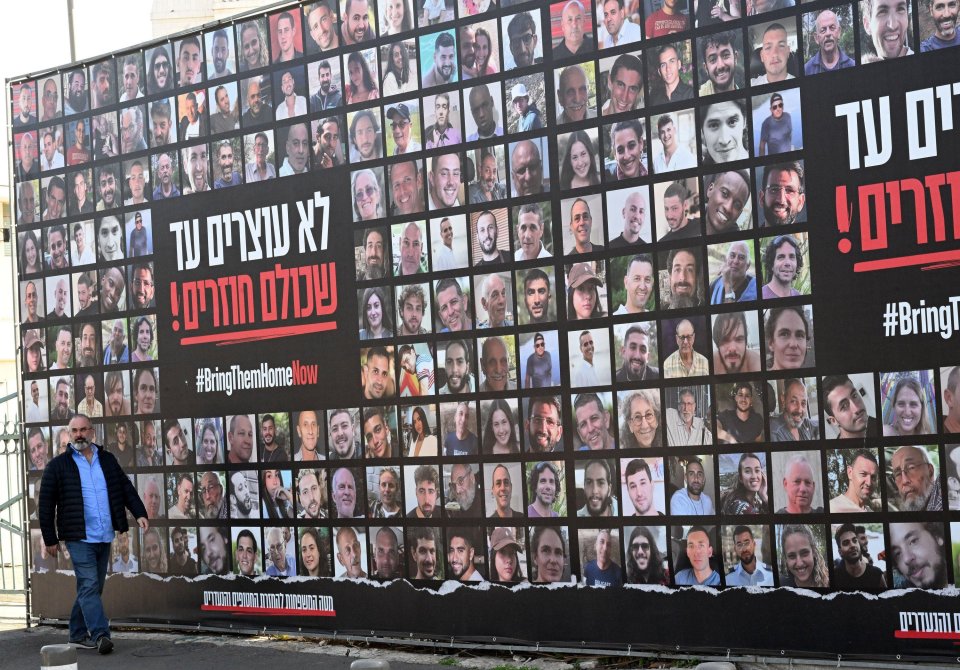 Billboard displaying photos of Israeli hostages with the hashtag #BringThemHomeNow.