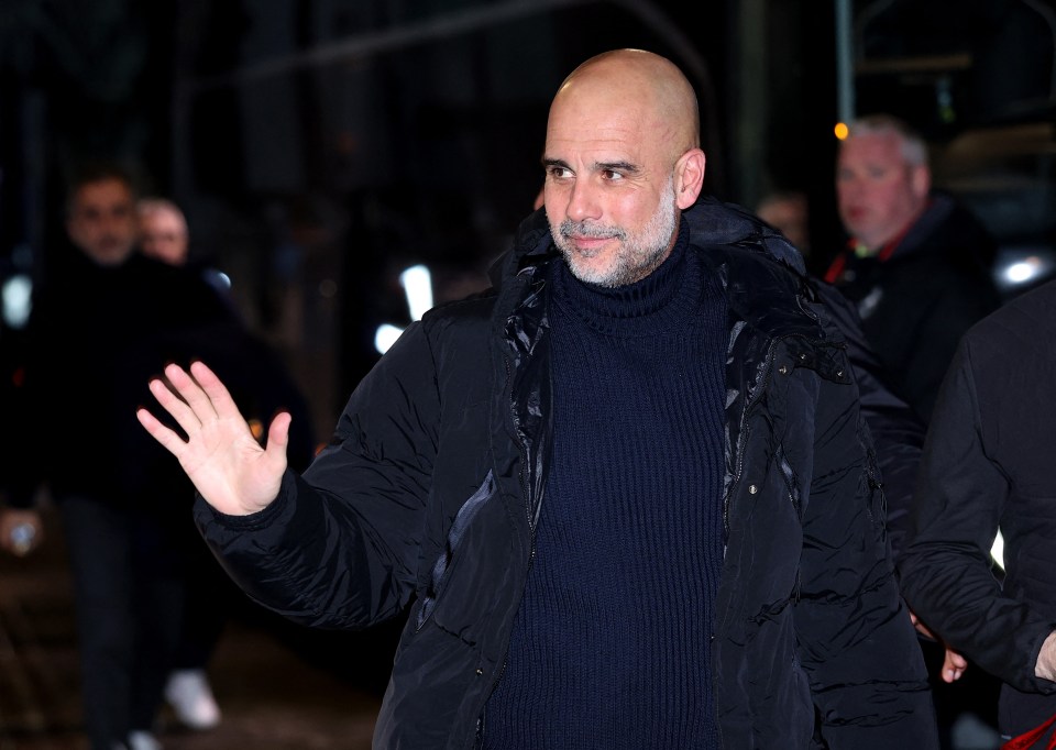 Pep Guardiola waving.