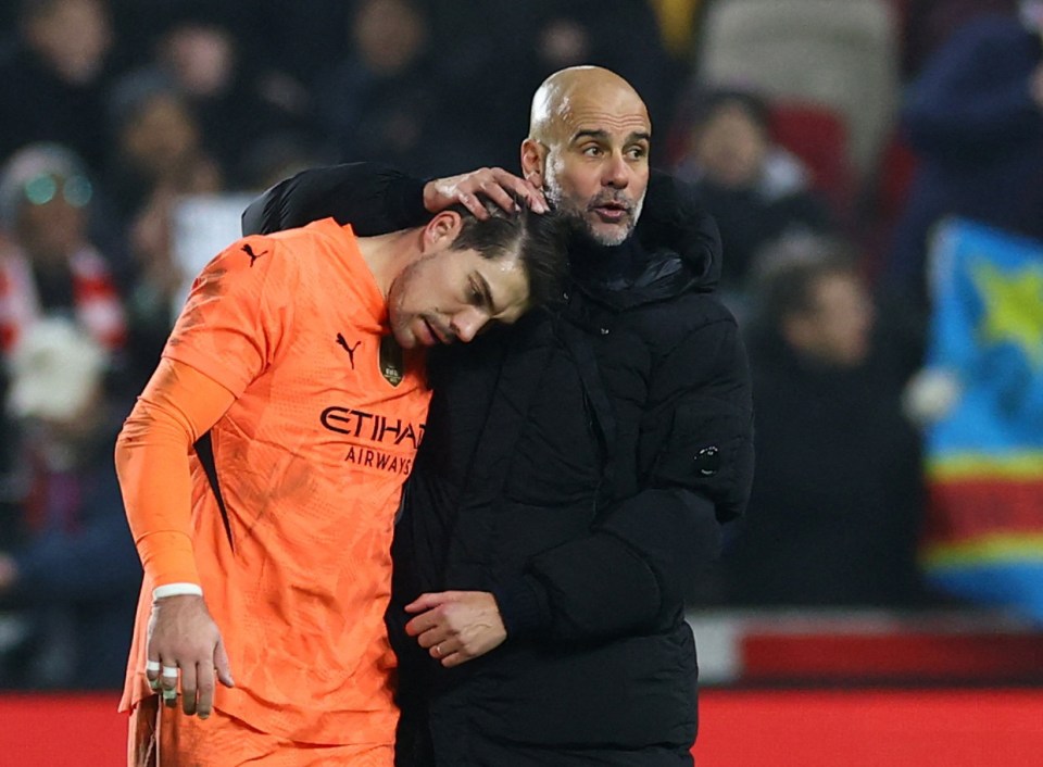 Pep Guardiola consoling Stefan Ortega.