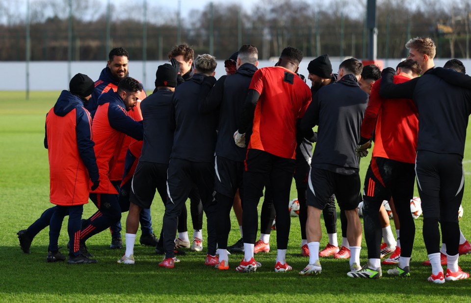 Manchester United manager Ruben Amorim with players during training.