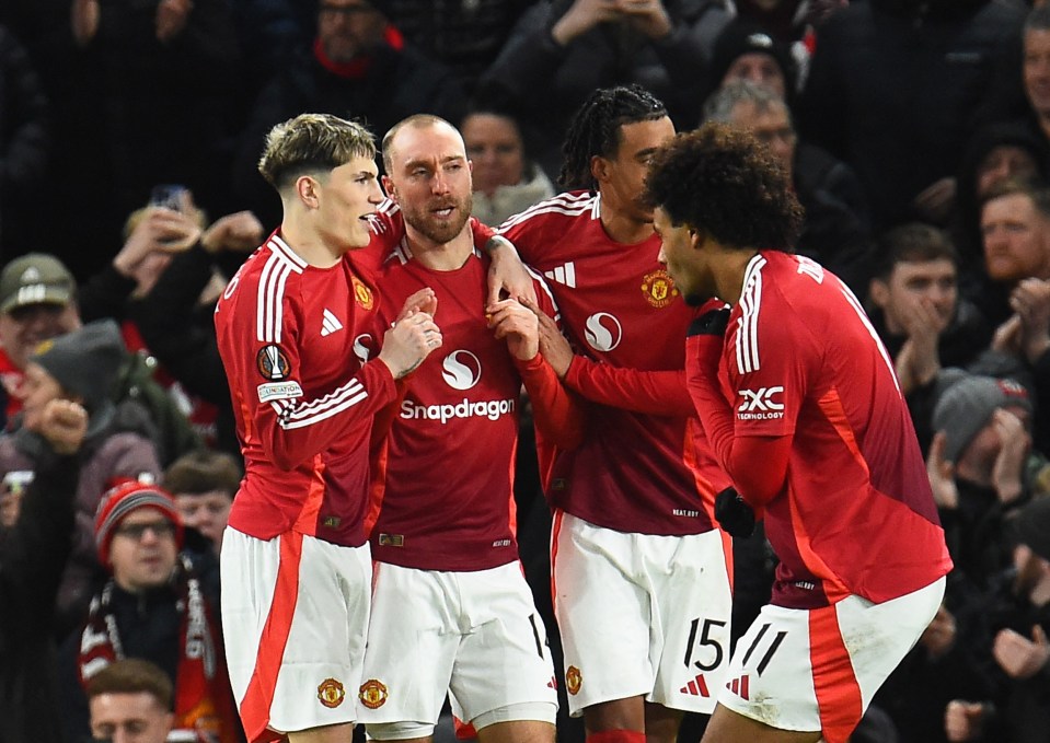 Manchester United players celebrating a goal.