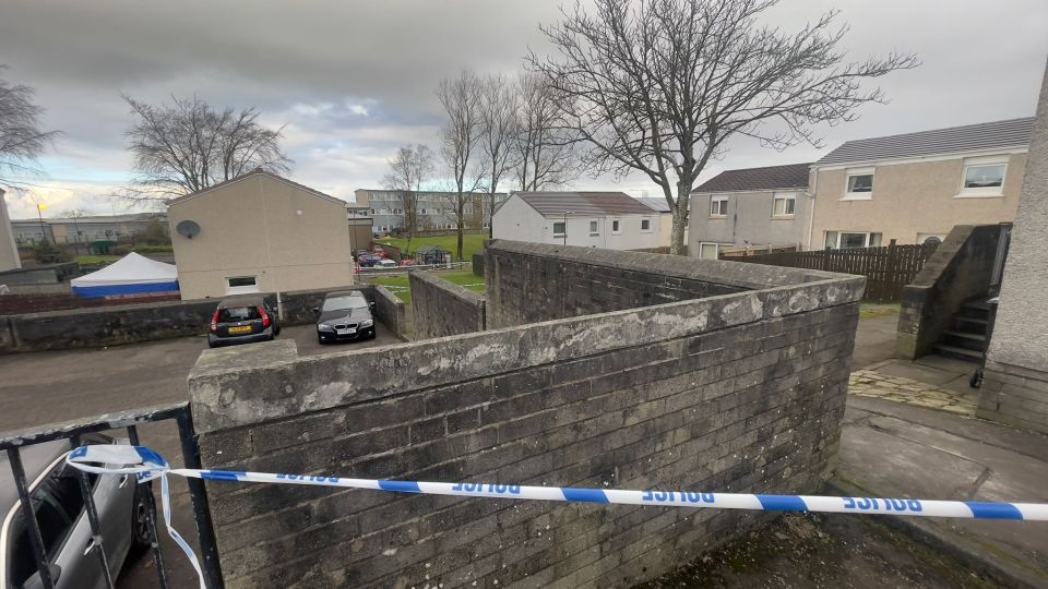 Crime scene in West Calder with police tape.