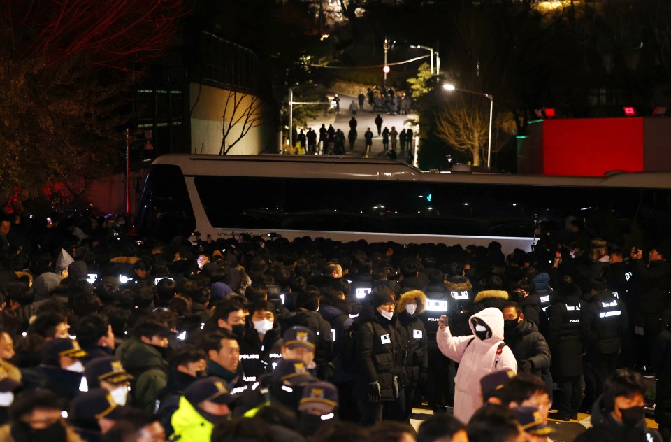 Police and anti-corruption agents attempt to arrest impeached South Korean President Yoon Suk Yeol.