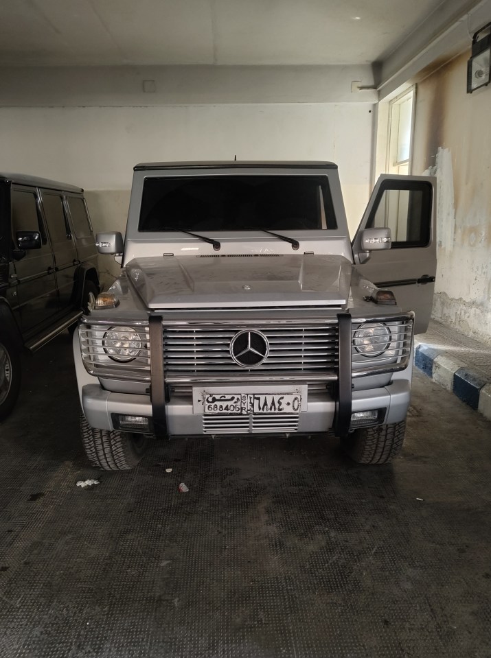 Silver Mercedes-Benz G-Class in a garage.