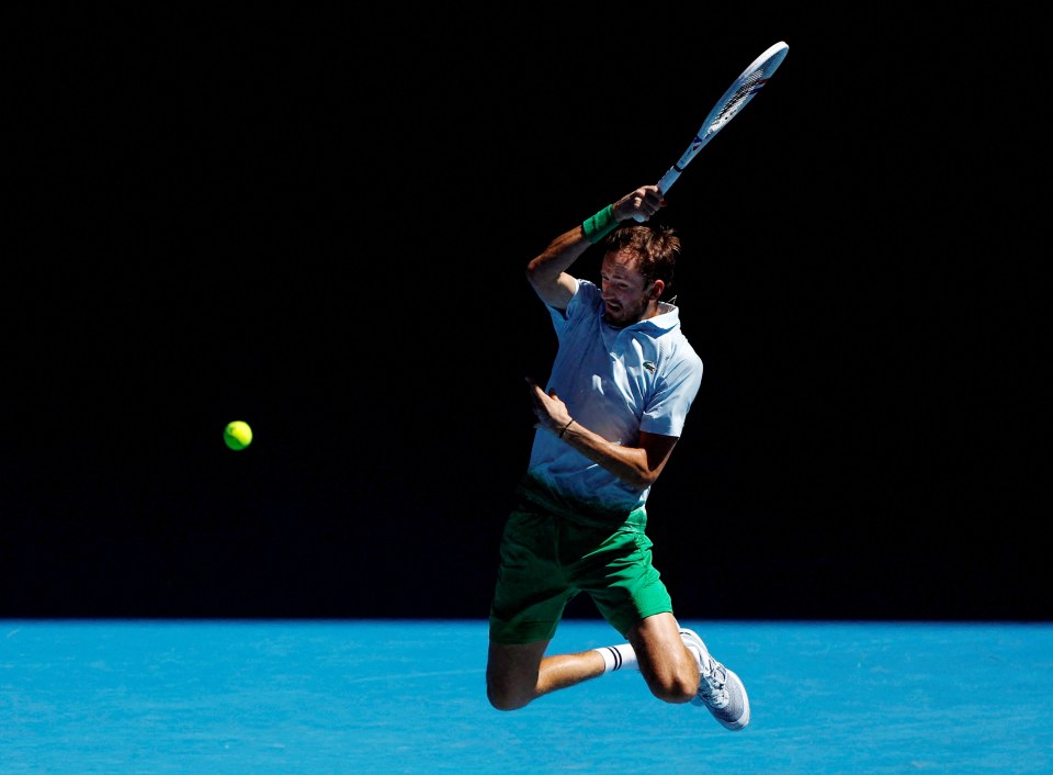 Daniil Medvedev playing tennis.