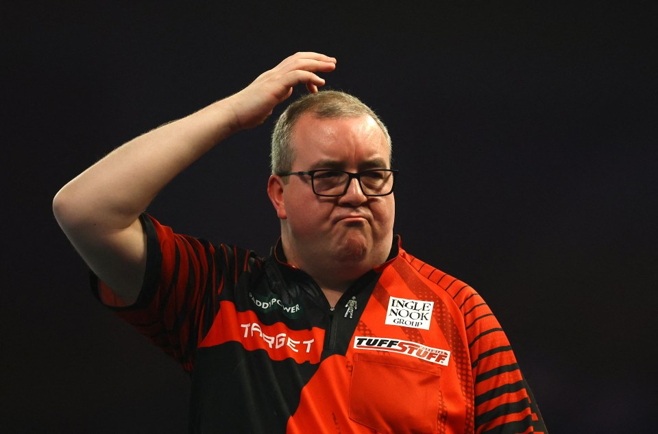 Stephen Bunting reacts during a darts match.