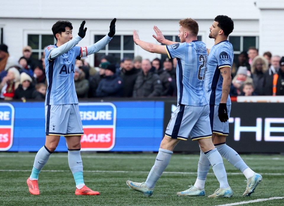 Tottenham Hotspur players celebrating a goal.